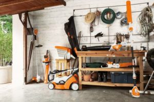 STIHL AK System Range including a cordless chainsaw and cordless lawn mower.