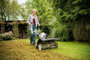 The STIHL MM 56 being used in the garden