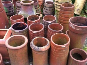 recycled chimney pots can be used as plant pots